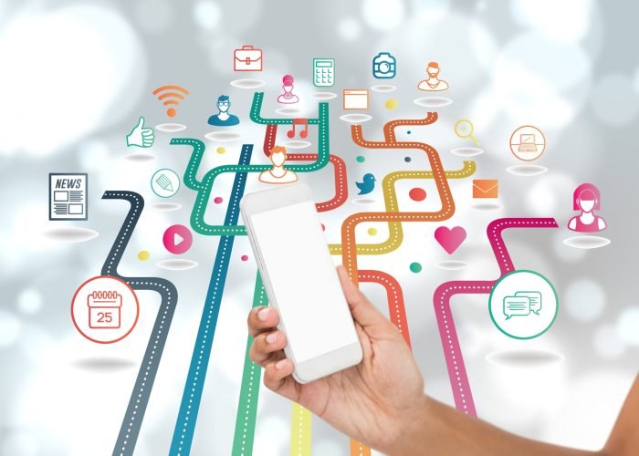 digital composite of hand holding smartphone with vignettes